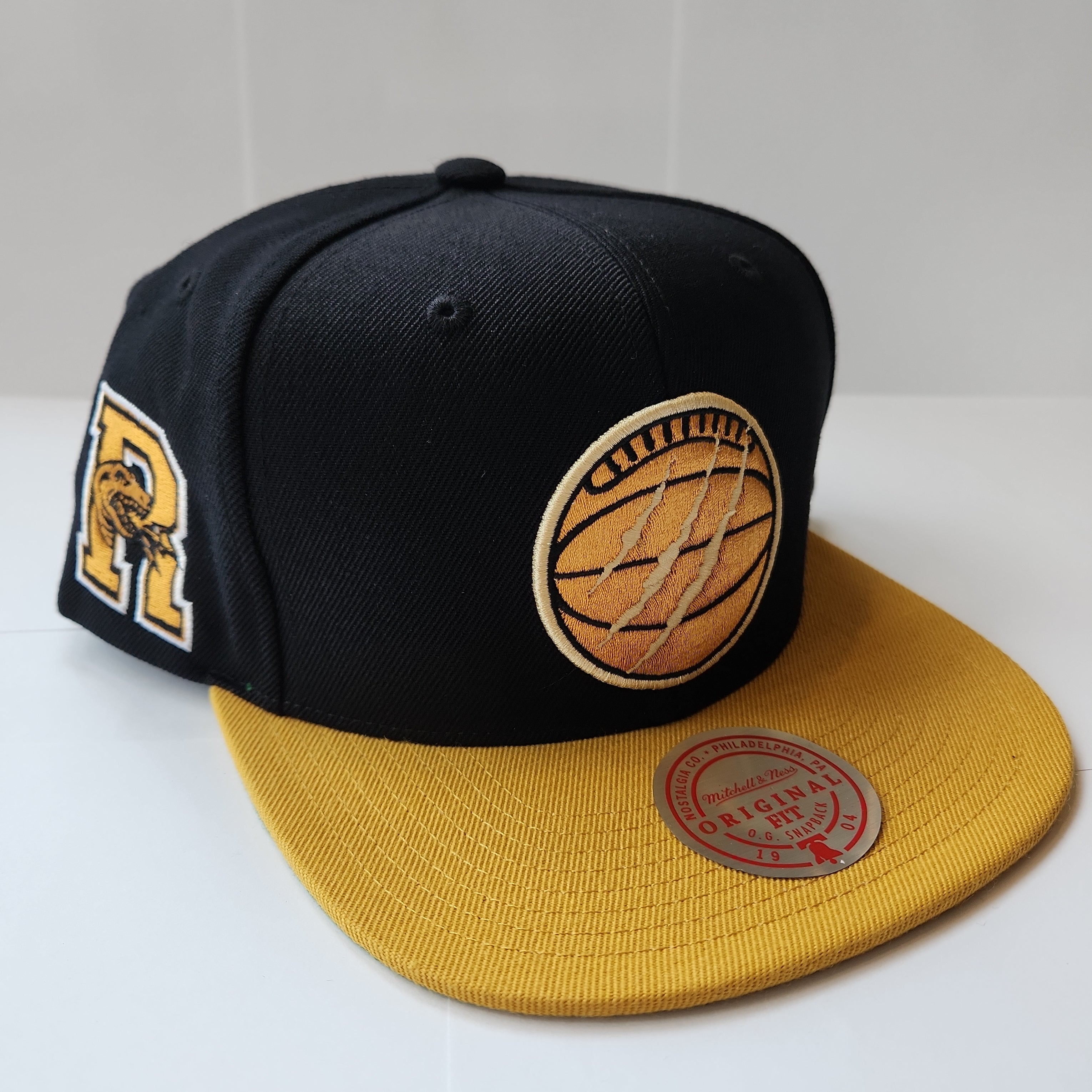 Toronto Raptors NBA Mitchell & Ness pour hommes Black Eye of The Tiger Snapback